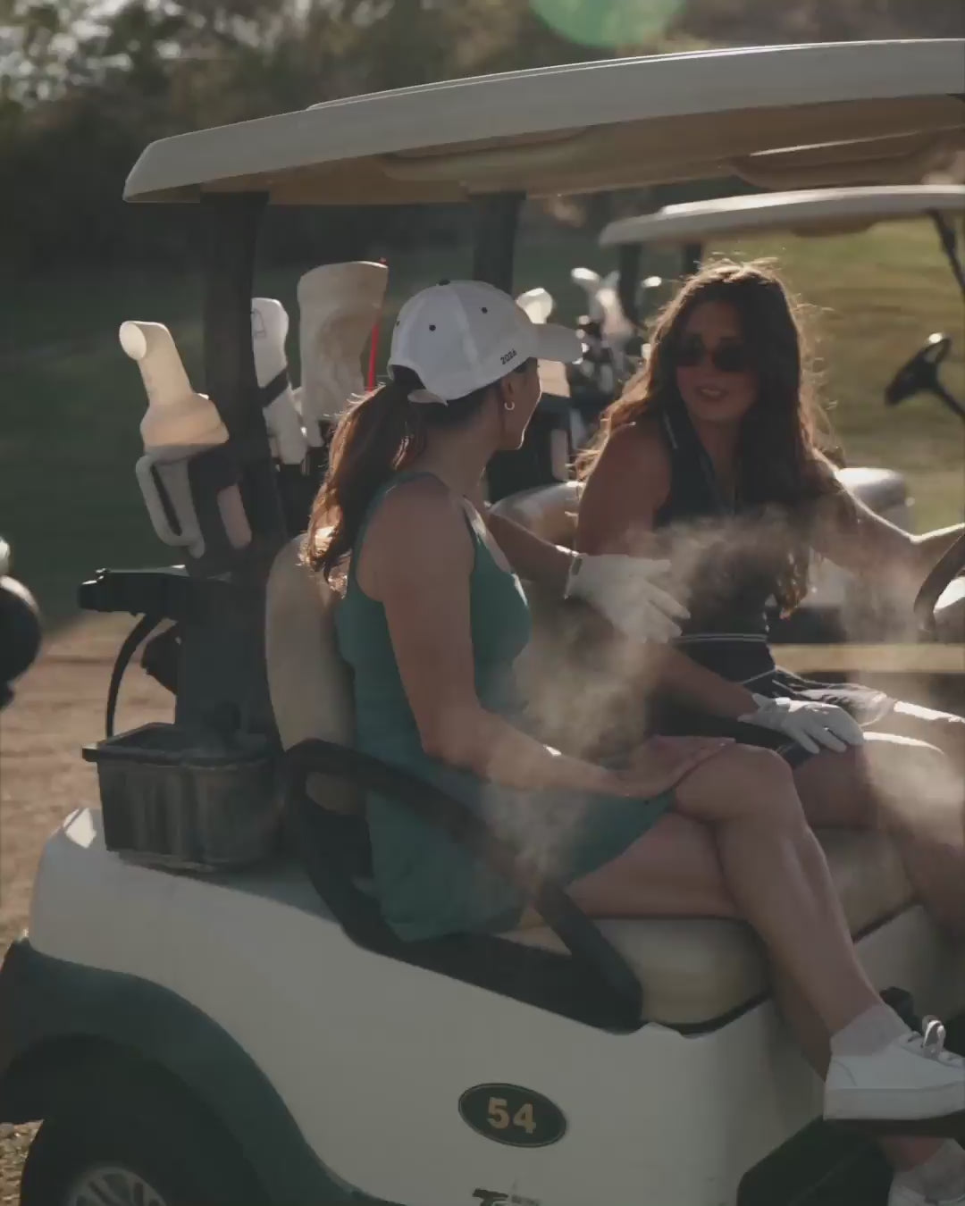 Load video: golfers in golf cart